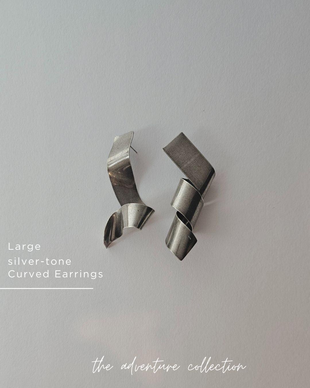 Curly silver tone Earrings