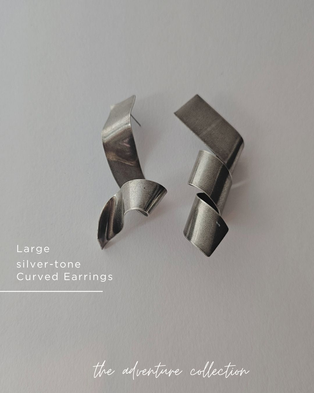 Curly silver tone Earrings