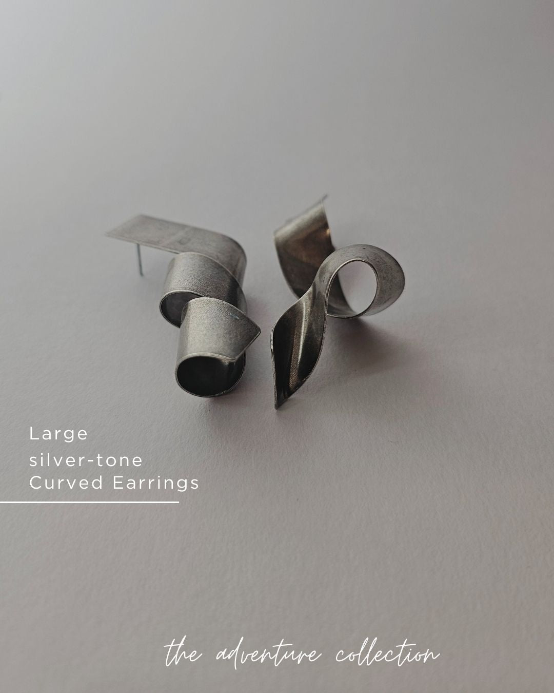Curly silver tone Earrings
