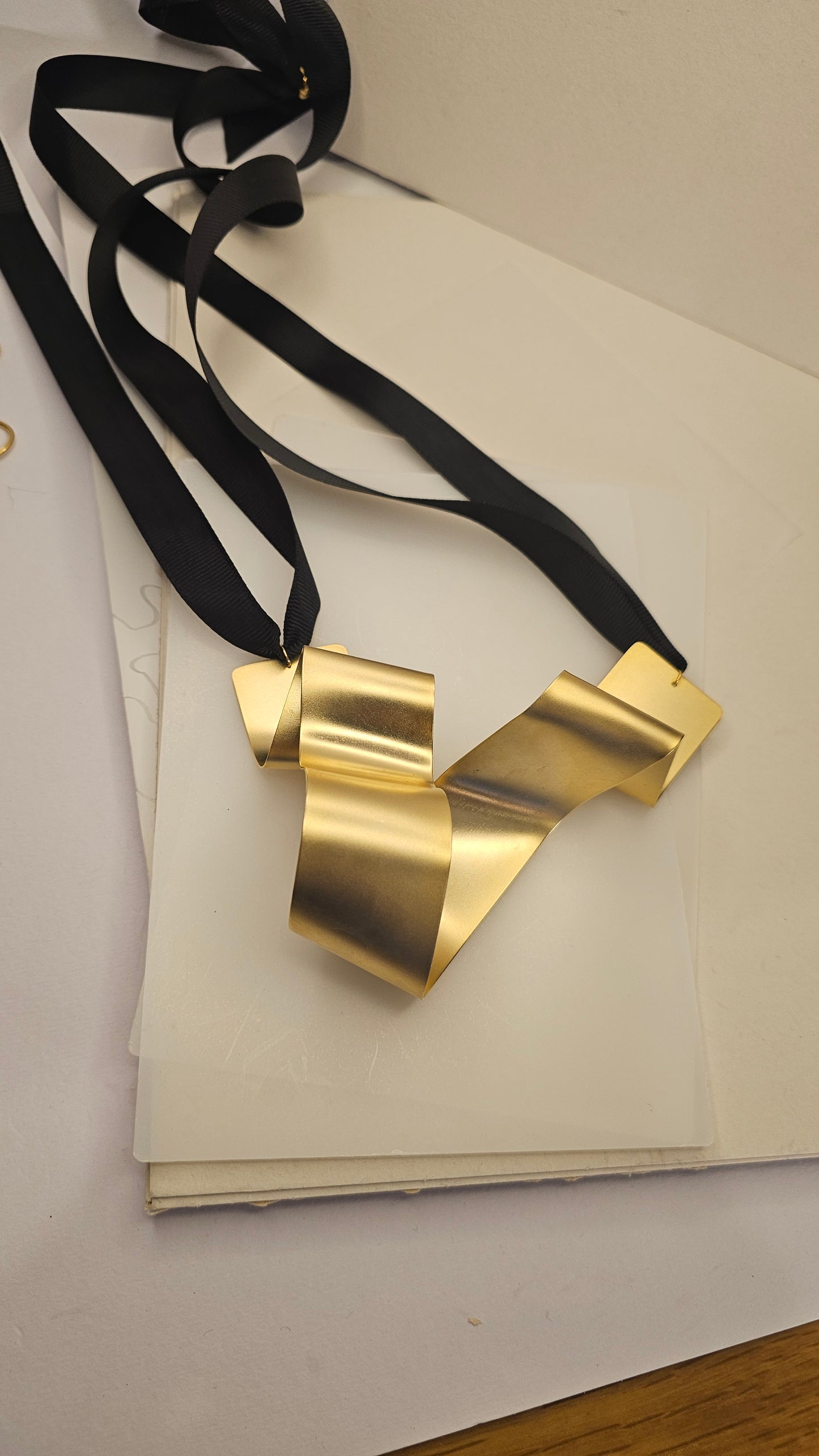 Sculptural Gold-Plated Ribbon Necklace – Bold & Artistic - made by order