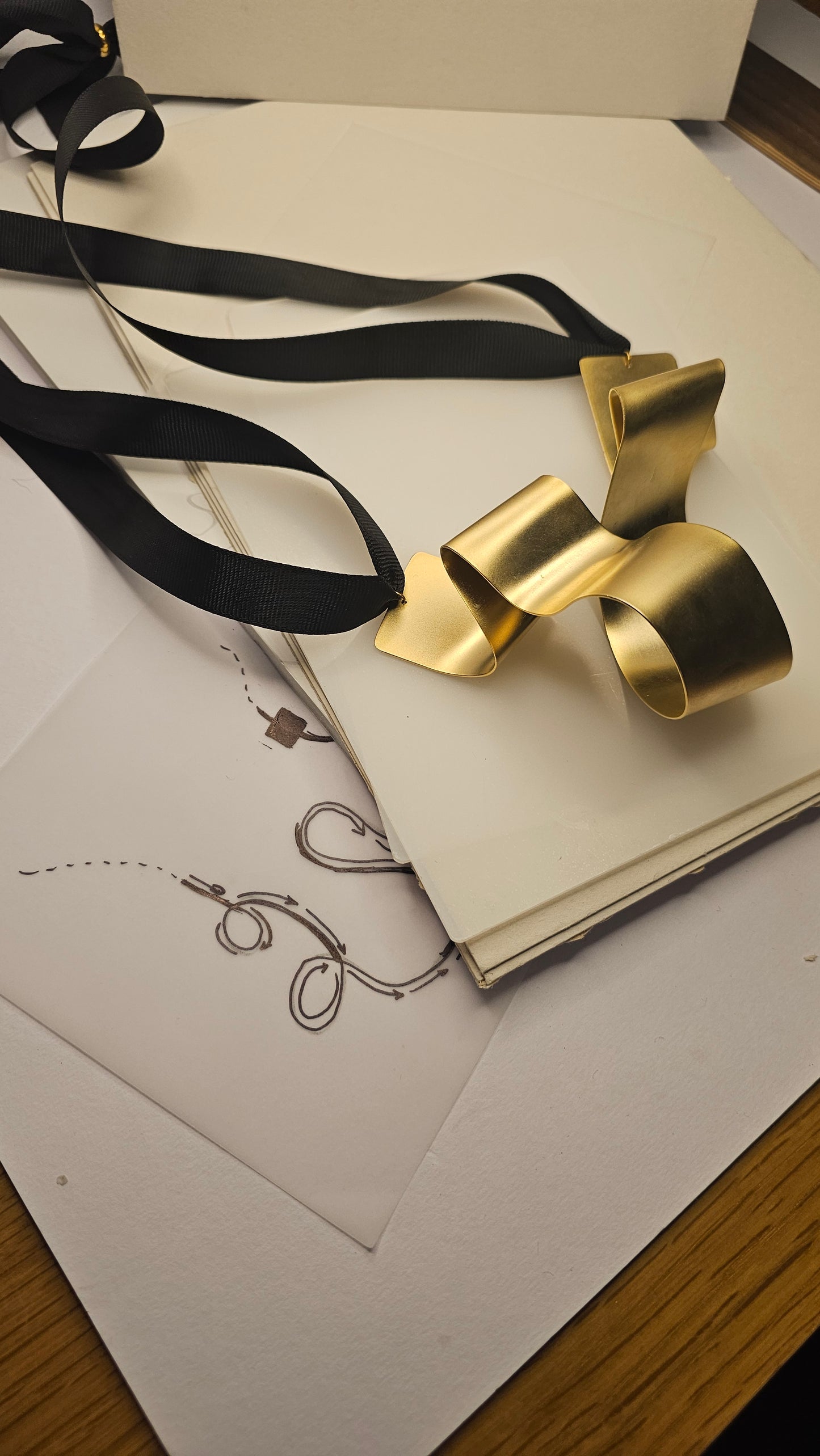 Sculptural Gold-Plated Ribbon Necklace – Bold & Artistic - made by order