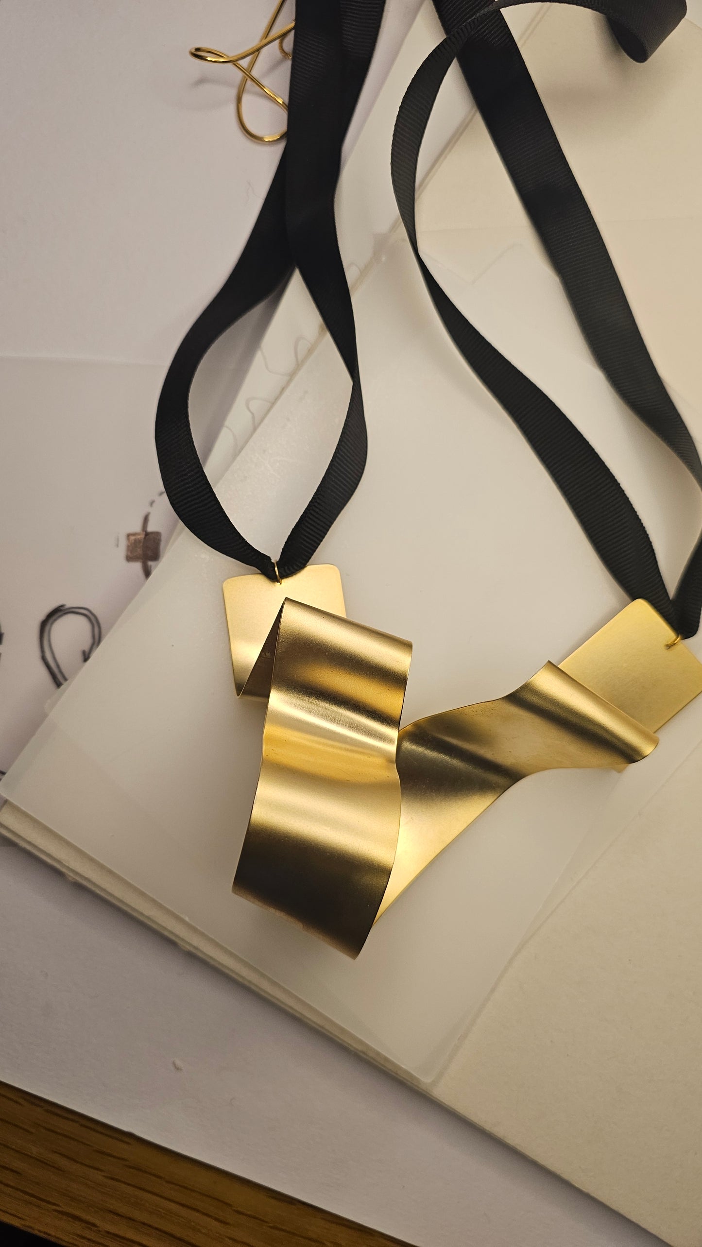Sculptural Gold-Plated Ribbon Necklace – Bold & Artistic - made by order