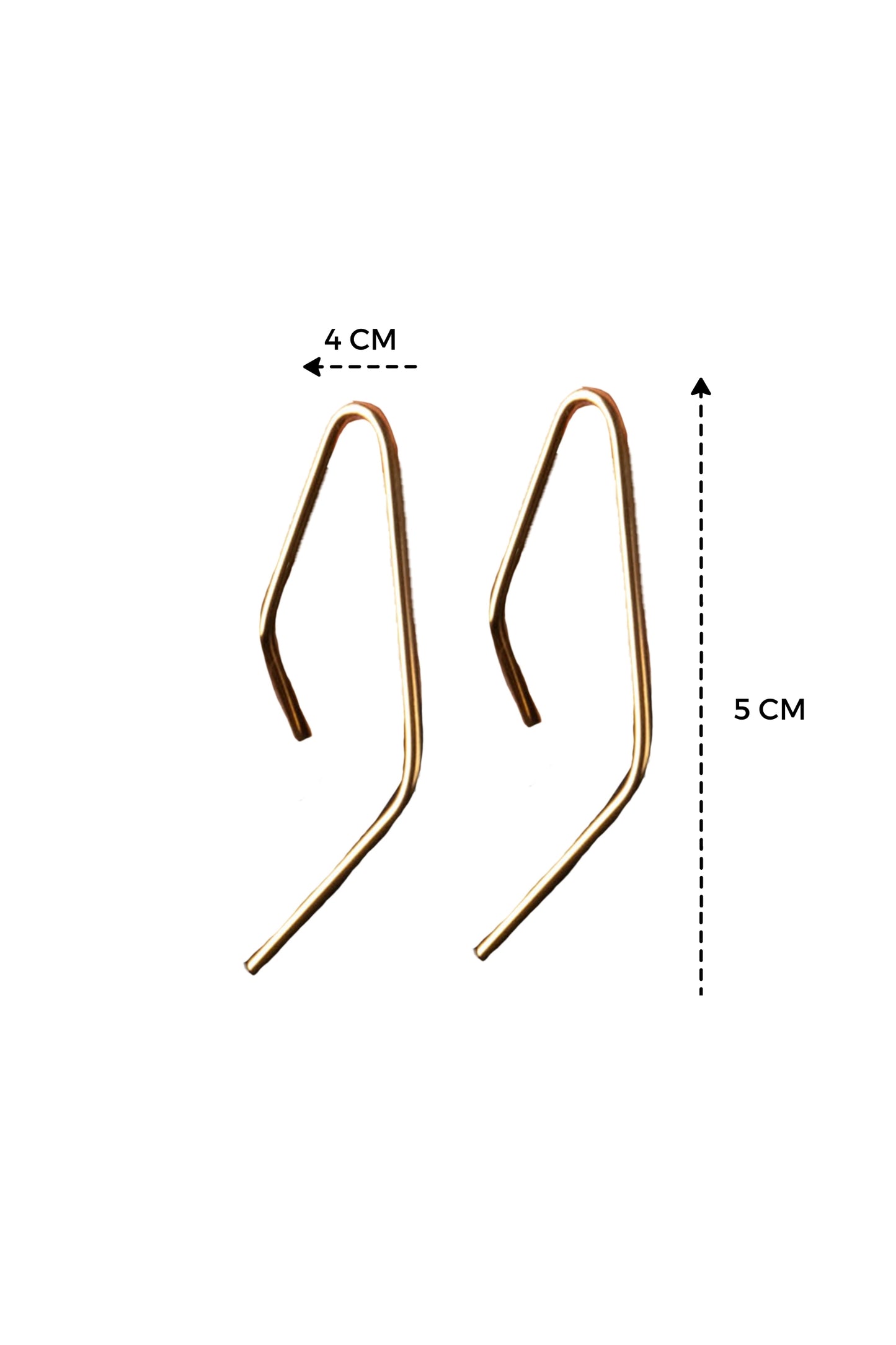a pair of gold earrings with a length guide