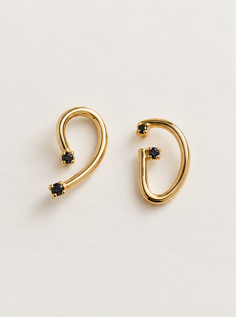 Figaro Earrings (FGR-2602), handmade asymmetric gold-plated earrings with black stones by OTILYAS, front view