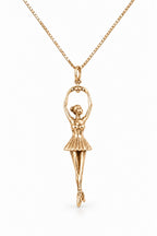 Ballerina Pendant in 14k gold, arms raised overhead holding the bail, on a box chain