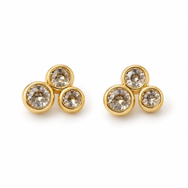 Little Cloud Earrings in 14k yellow gold, three bezel-set zirconia stones gathered like a little cloud, by OTILYAS