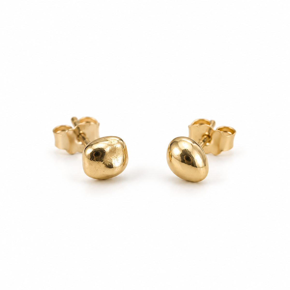 Little Studs in 14k yellow gold, close-up of the two irregular, asymmetrical studs with butterfly backs