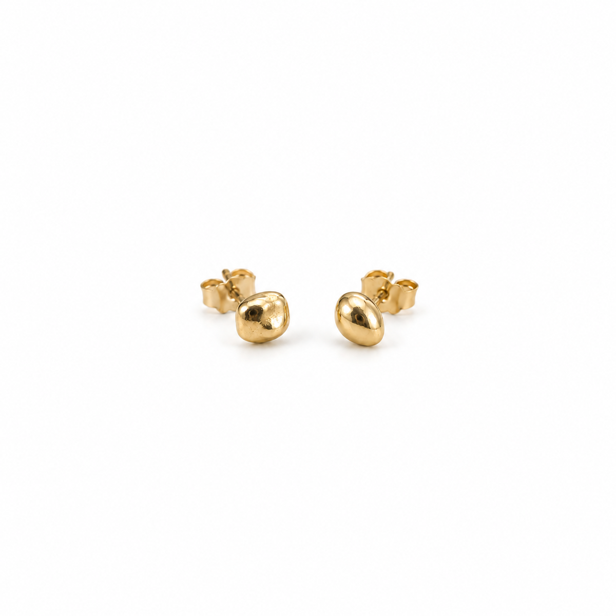 Pair of Little Studs, small irregular 14k yellow gold stud earrings, on a white background