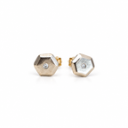 Front view of the Little Studs pair in 14k white gold, faceted hexagon studs with a small natural diamond in the centre of each