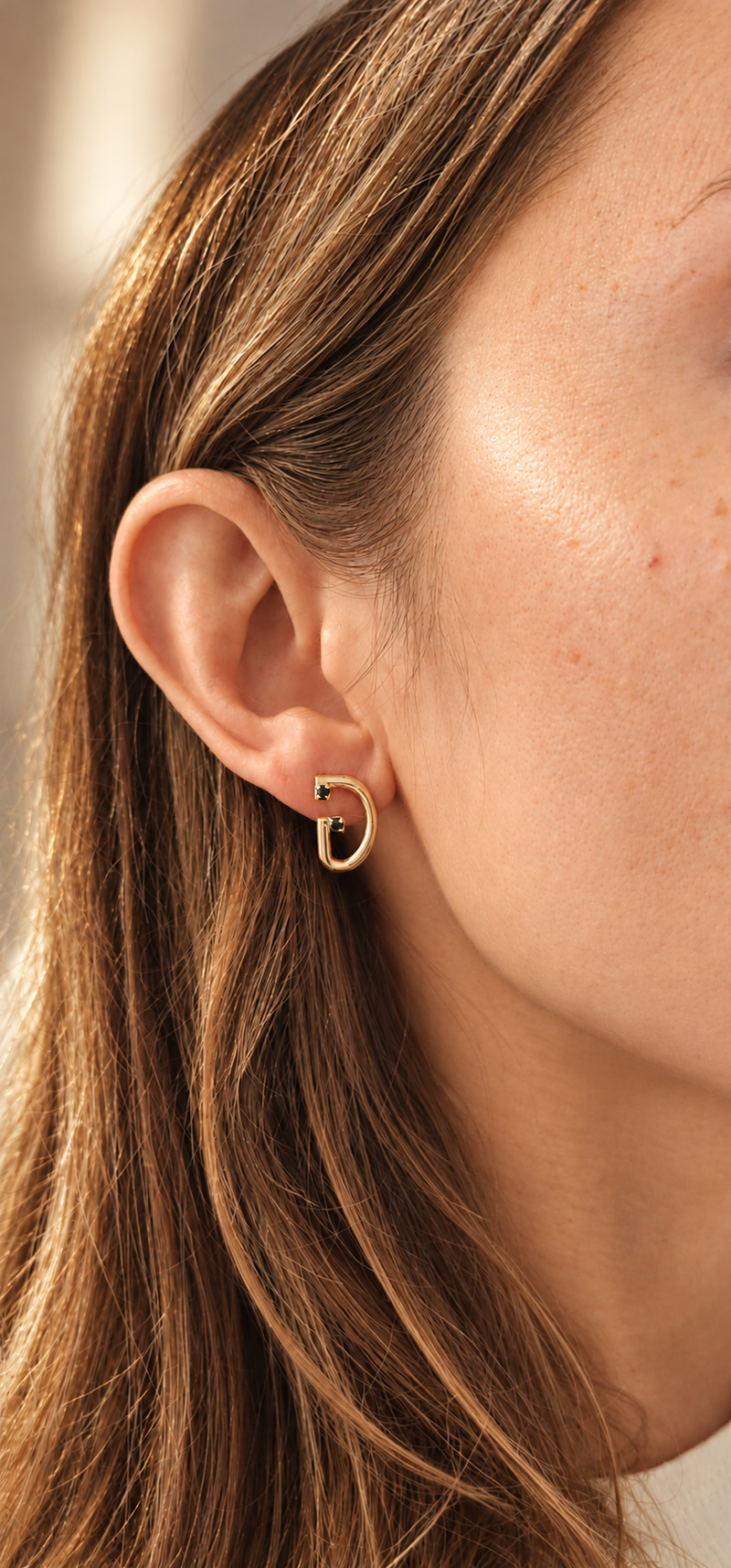 Figaro Earrings FGR-2602 worn on the ear, D-shaped earring