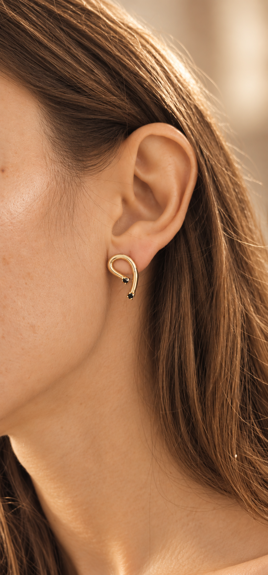 Figaro Earrings FGR-2602 worn on the ear, hook-shaped earring