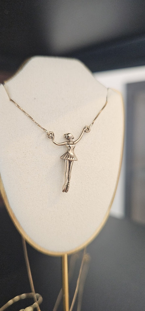 Ballerina Connector Necklace in 14k gold on a box chain, on a display bust in the OTILYAS studio