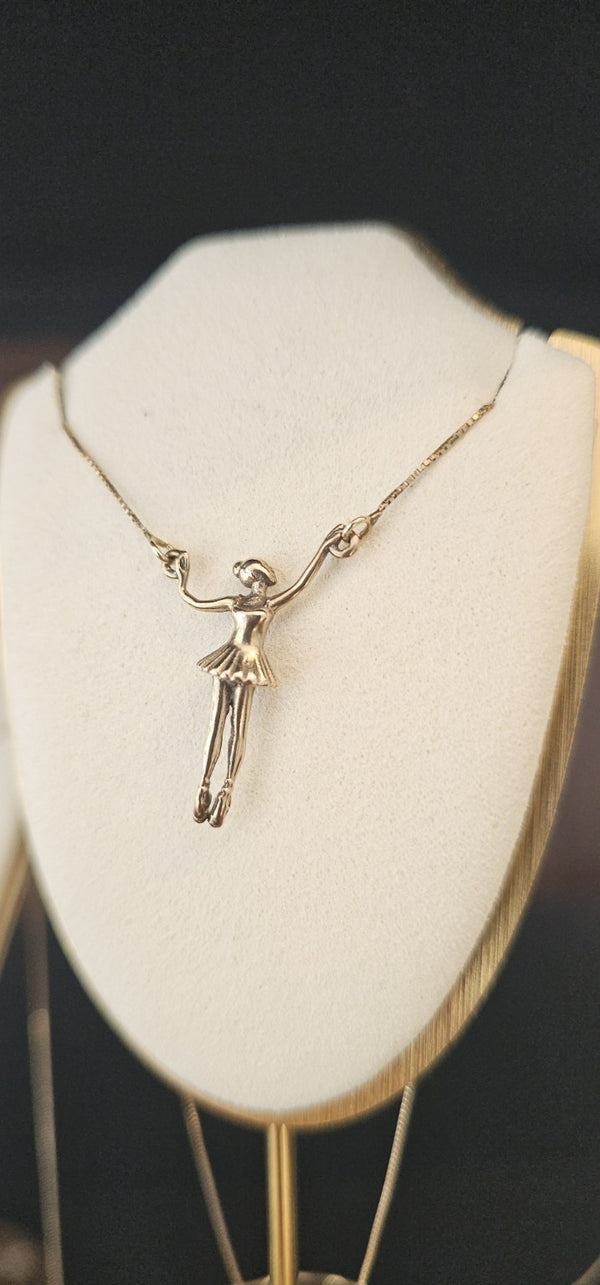 Ballerina Connector Necklace in 14k gold on a box chain, on a display bust in the OTILYAS studio