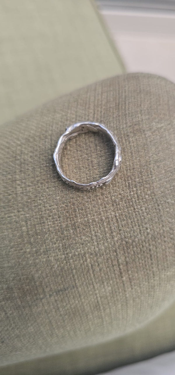 The Carmel ring lying on linen, seen from above