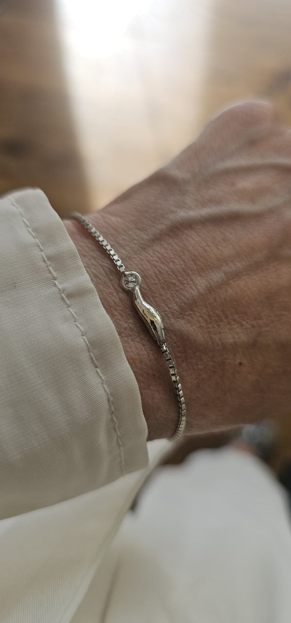 The cloud bracelet in 18k white gold with a lab-grown diamond, worn on the wrist