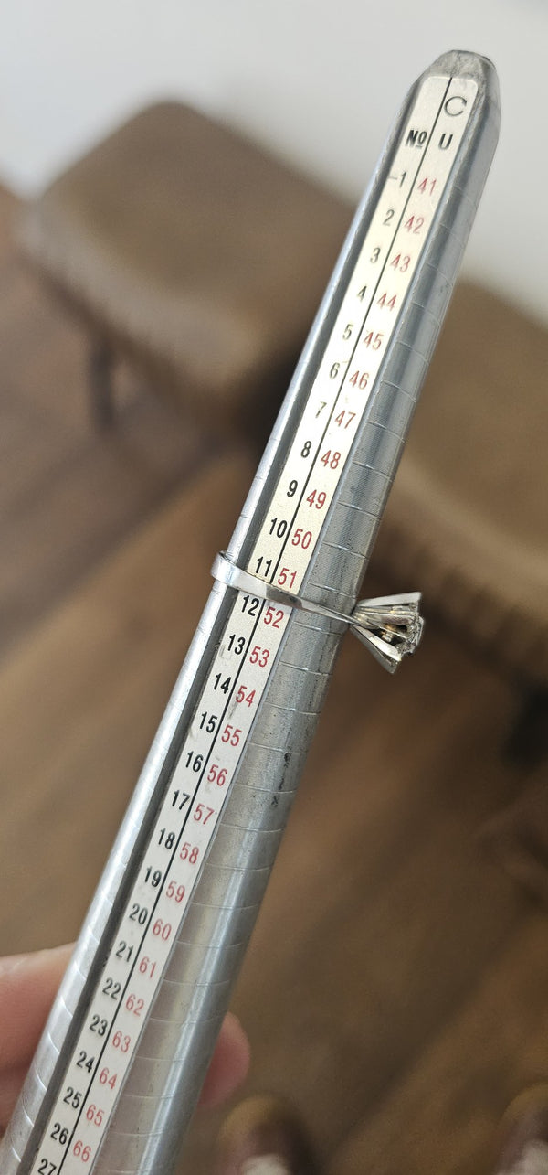 The Platinum Star Ring in the OTILYAS studio, on the ring sizer
