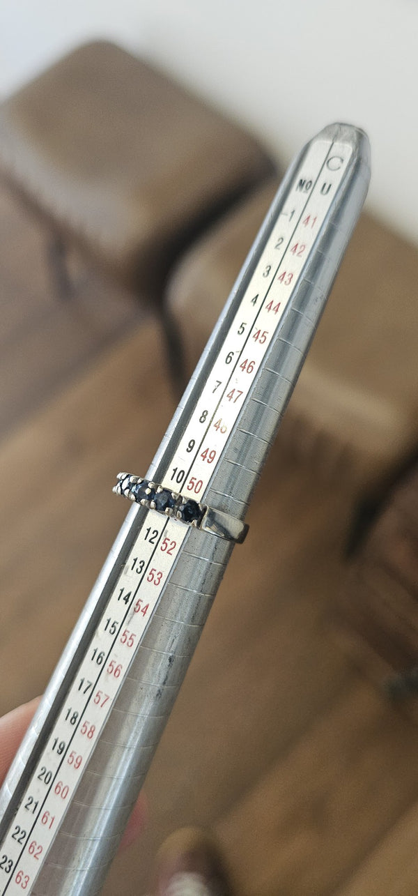 The Sapphire Crown Ring in the OTILYAS studio, on the ring sizer