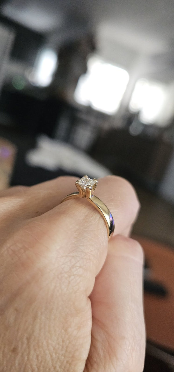 The Sun Square Ring held in hand in the OTILYAS studio