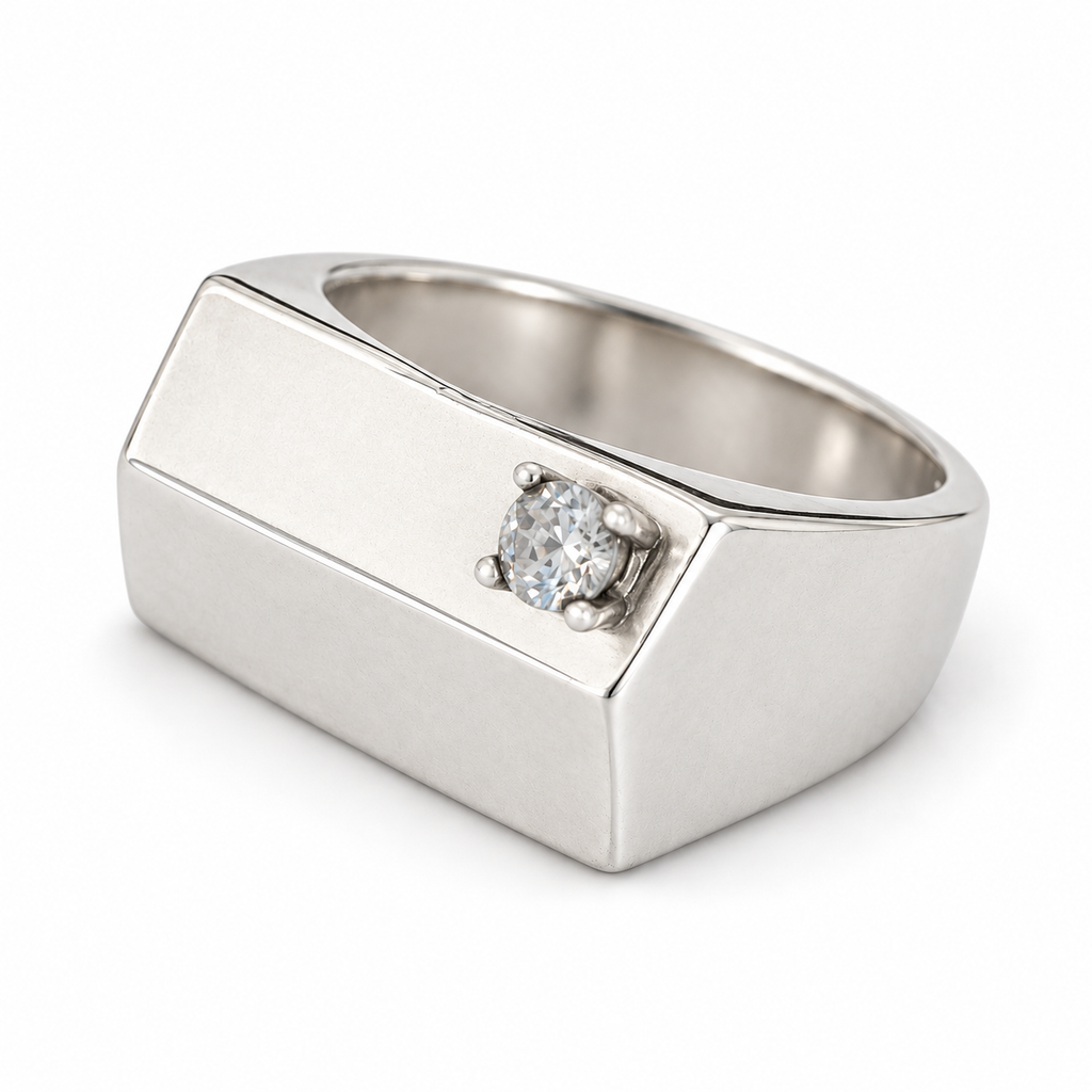 Pinky signet ring in 925 sterling silver with a flat rectangular top and an off-centre zircon in a 4-prong setting