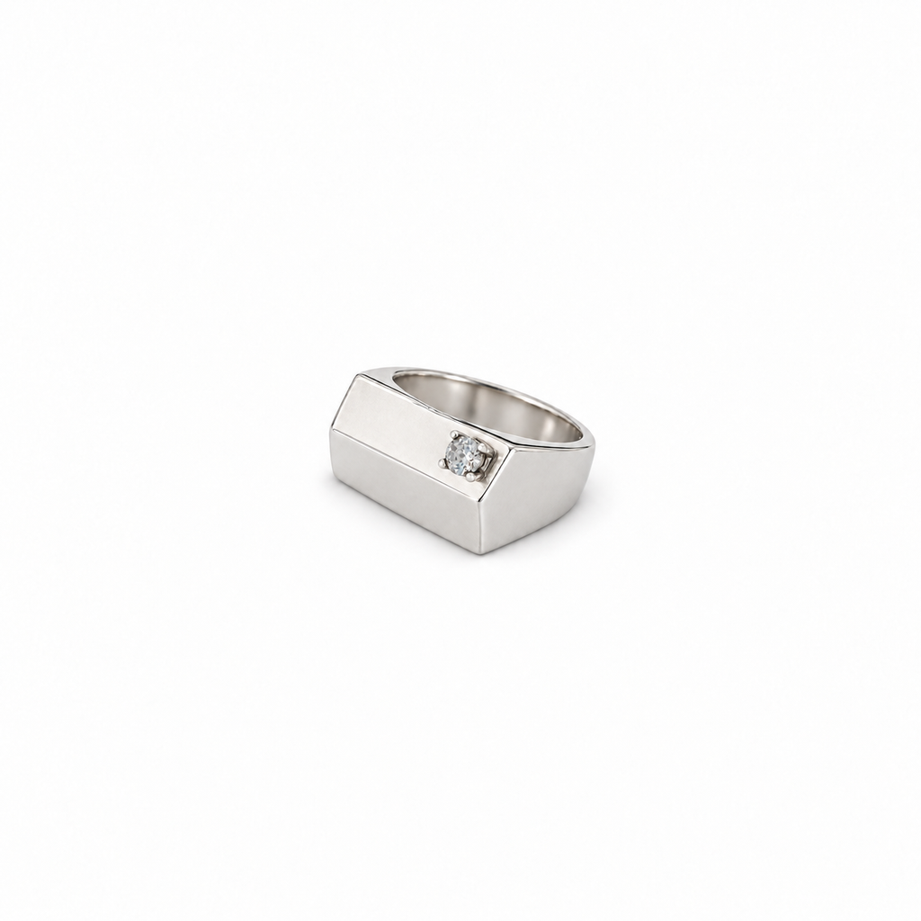 The silver pinky signet ring with zircon shown small on a white background