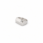 The silver pinky signet ring with zircon shown small on a white background